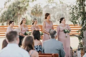 Wedding guests dressed in garden party attire at a Palm Beach wedding venue
